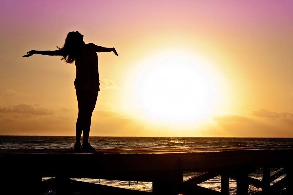 Model standing in front of sunset